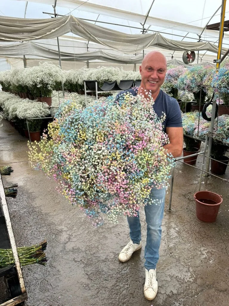 John Buskermolen reviewing distinctive flower products